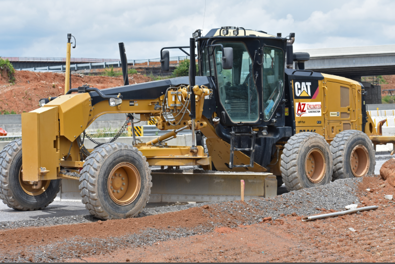 Motor grader performing civil site grading